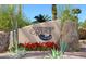 Scottsdale Ranch community sign surrounded by desert landscaping and vibrant red flowers at 9115 N 101St Way, Scottsdale, AZ 85258