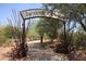 Desert Garden featuring a decorative entrance sign and a scenic pathway at 9115 N 101St Way, Scottsdale, AZ 85258