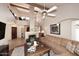 Spacious living room with vaulted ceiling, fireplace, neutral paint, comfortable seating, and eye catching decor at 9115 N 101St Way, Scottsdale, AZ 85258