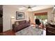 Bright office space featuring a large window and a comfortable sofa at 9115 N 101St Way, Scottsdale, AZ 85258