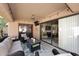 Relaxing covered patio with comfortable seating, stylish decor, and seamless indoor-outdoor flow at 9115 N 101St Way, Scottsdale, AZ 85258