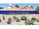 Attractive community sign with blue tile background and colorful flowers in a landscaped area at 9115 N 101St Way, Scottsdale, AZ 85258