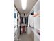 Custom walk-in closet with built-in shelving, drawers, and rods for ample storage in this spacious closet at 9115 N 101St Way, Scottsdale, AZ 85258