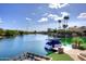 Dock on community lake featuring a boat and beautiful water views at 9115 N 101St Way, Scottsdale, AZ 85258