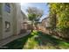 Beautiful backyard with a well-manicured lawn, and lush trees at 9224 E Windrose Dr, Scottsdale, AZ 85260