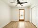 Cozy bedroom featuring a ceiling fan, natural light, and closet space at 9224 E Windrose Dr, Scottsdale, AZ 85260