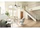 Open-concept living room with high ceilings, large windows, and hardwood floors at 9224 E Windrose Dr, Scottsdale, AZ 85260
