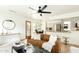 Open-concept living room with modern furnishings, hardwood flooring, and abundant light at 9224 E Windrose Dr, Scottsdale, AZ 85260