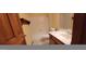 Well-lit bathroom featuring a shower-tub combo and a vanity with a large mirror for ample lighting at 949 N Ricardo N Cir, Mesa, AZ 85205