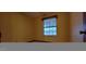 Bedroom featuring window for natural light, neutral carpeting, and room for relaxation and personalization at 949 N Ricardo N Cir, Mesa, AZ 85205