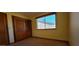 Cozy bedroom with carpet and wooden closet doors, providing a comfortable retreat at 949 N Ricardo N Cir, Mesa, AZ 85205