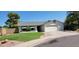 Charming one-story home with a well-maintained lawn, attached garage, and inviting curb appeal at 949 N Ricardo N Cir, Mesa, AZ 85205