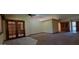Spacious living room with an open layout and double doors, perfect for entertaining and relaxation at 949 N Ricardo N Cir, Mesa, AZ 85205