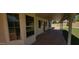 Covered patio featuring multiple windows and a ceiling fan, offering a comfortable outdoor living space at 949 N Ricardo N Cir, Mesa, AZ 85205