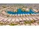 Expansive aerial view of a neighborhood on a lake featuring mature trees and desert landscaping at 10526 W Tonopah Dr, Peoria, AZ 85382