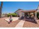Expansive backyard featuring a covered patio, desert landscaping, and serene neighborhood views at 10526 W Tonopah Dr, Peoria, AZ 85382