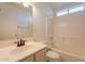 Bathroom features a tiled shower-tub combo, modern vanity and neutral fixtures at 10526 W Tonopah Dr, Peoria, AZ 85382