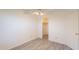 Bright bedroom features a closet, neutral walls and modern gray flooring at 10526 W Tonopah Dr, Peoria, AZ 85382