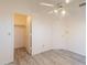 Bright bedroom features a closet, ceiling fan, neutral walls and gray flooring at 10526 W Tonopah Dr, Peoria, AZ 85382