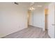 Bright bedroom features a ceiling fan, neutral walls and modern gray flooring at 10526 W Tonopah Dr, Peoria, AZ 85382