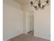 Dining room with decorative light fixture and tile flooring at 10526 W Tonopah Dr, Peoria, AZ 85382