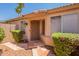 Home front entrance with stone walkway, screen door, and desert landscaping at 10526 W Tonopah Dr, Peoria, AZ 85382