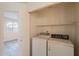 Laundry closet features modern washer and dryer units at 10526 W Tonopah Dr, Peoria, AZ 85382