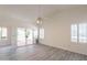 Spacious main bedroom featuring a ceiling fan and access to an outdoor patio at 10526 W Tonopah Dr, Peoria, AZ 85382