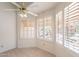 Bright breakfast nook with shuttered windows and a ceiling fan at 10526 W Tonopah Dr, Peoria, AZ 85382