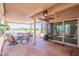Spacious covered patio featuring a dining area overlooking a tranquil lake view at 10526 W Tonopah Dr, Peoria, AZ 85382