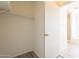 Empty walk-in closet featuring shelving and access to the bathroom at 10526 W Tonopah Dr, Peoria, AZ 85382
