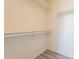 Empty walk-in closet featuring shelving with a view of the floor at 10526 W Tonopah Dr, Peoria, AZ 85382