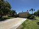 Inviting single-story home with a long driveway and lush green landscaping, enhancing its curb appeal at 10647 W Campana Dr, Sun City, AZ 85351