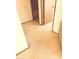 Hallway leading to bedroom with beige carpeting and neutral walls at 10647 W Campana Dr, Sun City, AZ 85351