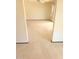 Hallway leading to bedroom with beige carpeting and neutral walls at 10647 W Campana Dr, Sun City, AZ 85351