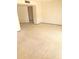 Open living room featuring neutral walls, carpet flooring, and natural light at 10647 W Campana Dr, Sun City, AZ 85351