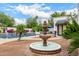 Beautiful backyard fountain with pool and lush landscaping at 10662 E Carol Ave, Scottsdale, AZ 85258