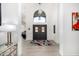 Bright entryway showcases a decorative front door with tiled flooring and an arched window above at 10662 E Carol Ave, Scottsdale, AZ 85258