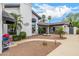 Charming home exterior with a circular driveway, mature landscaping, and fountain at 10662 E Carol Ave, Scottsdale, AZ 85258