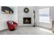Modern fireplace with elegant decor, comfortable seating, and neutral flooring at 10662 E Carol Ave, Scottsdale, AZ 85258