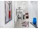 Inviting foyer with high ceilings, modern artwork, and stylish decor leading to a bright and open living space at 10662 E Carol Ave, Scottsdale, AZ 85258