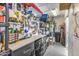 Functional garage space with pegboard, work bench, lots of storage and tools organized on display at 10662 E Carol Ave, Scottsdale, AZ 85258