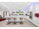 Modern kitchen with stainless steel appliances, a large center island, and bright lighting at 10662 E Carol Ave, Scottsdale, AZ 85258