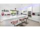 Spacious kitchen with a center island, breakfast bar seating, stainless appliances and plenty of natural light at 10662 E Carol Ave, Scottsdale, AZ 85258