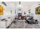Expansive living room featuring a high ceiling, stylish decor, and comfortable seating at 10662 E Carol Ave, Scottsdale, AZ 85258