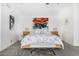 Bright and modern main bedroom featuring a unique bed frame, bench, and abstract artwork at 10662 E Carol Ave, Scottsdale, AZ 85258