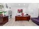 Bright office space with a custom desk, plenty of storage, modern lighting, and a comfortable seating area at 10662 E Carol Ave, Scottsdale, AZ 85258