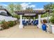 Inviting outdoor lounge area with comfortable seating and a cozy fireplace at 10662 E Carol Ave, Scottsdale, AZ 85258