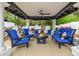 Inviting outdoor seating area with fire pit and comfortable blue chairs at 10662 E Carol Ave, Scottsdale, AZ 85258