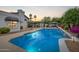 Stunning pool area featuring elegant waterfalls, lush landscaping and a gazebo for relaxation at 10662 E Carol Ave, Scottsdale, AZ 85258